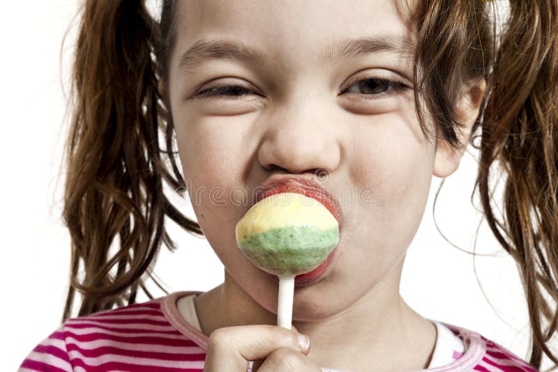 Close-up of little girl with a lollipop