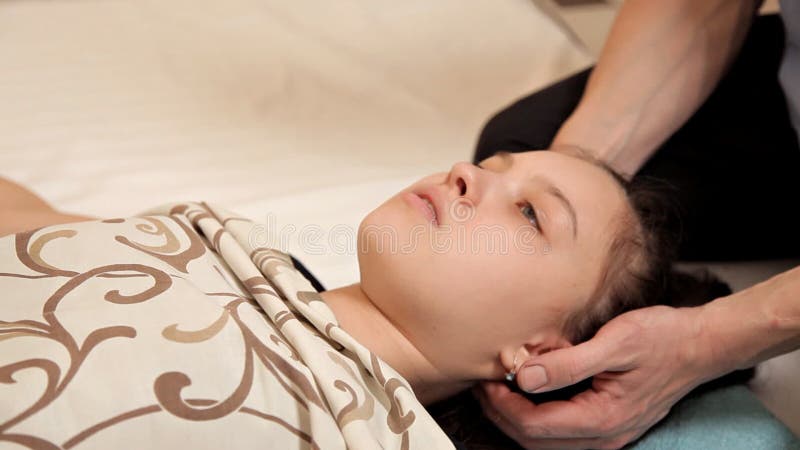 Close-up of a Little Girl at an Osteopathic Therapy Session. the Therapist Manipulates the Child`s Head Stock Video - Video of hand, manipulation: 148095991