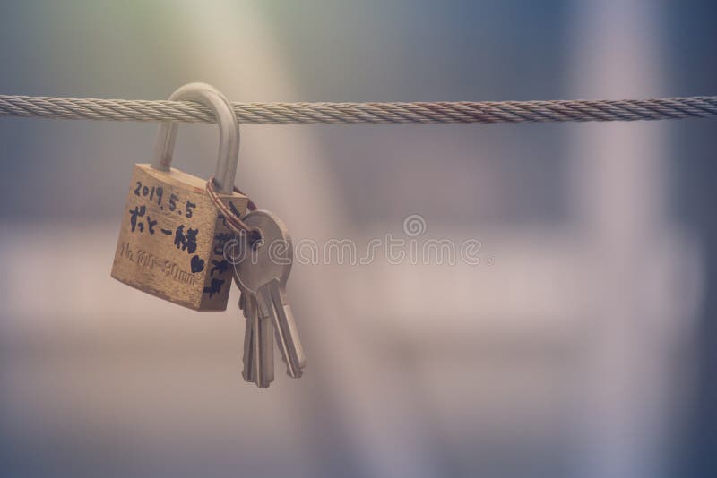 Close up love locks or padlocks hang on steel wire at Mount Moiwa, Sapporo. royalty free stock photography Close up love locks or padlocks hang on steel wire at Mount Moiwa, Sapporo. royalty free stock photography