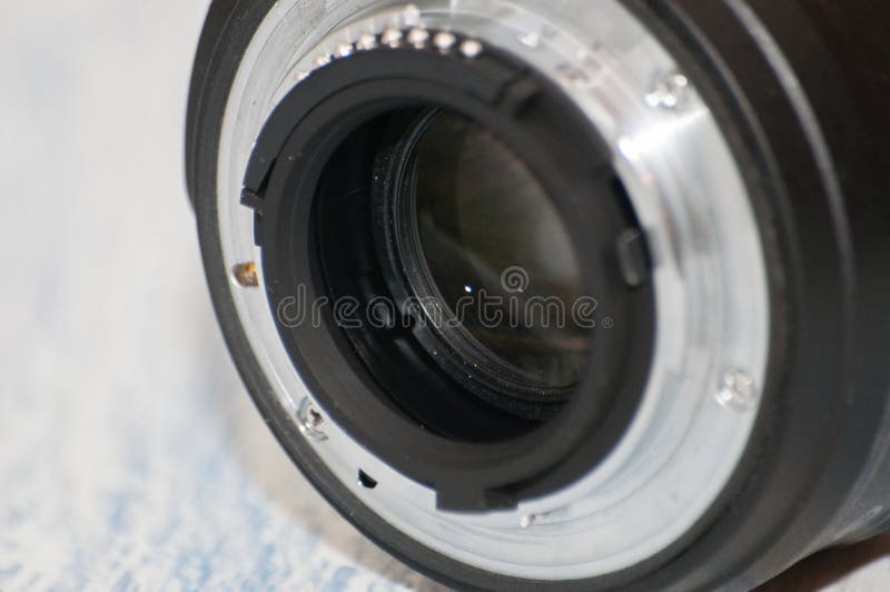 Close-up, macro, back part of camera lens, side view. Concept of camera, service center. There is a place for text stock photography Close-up, macro, back part of camera lens, side view. Concept of camera, service center. There is a place for text stock photography