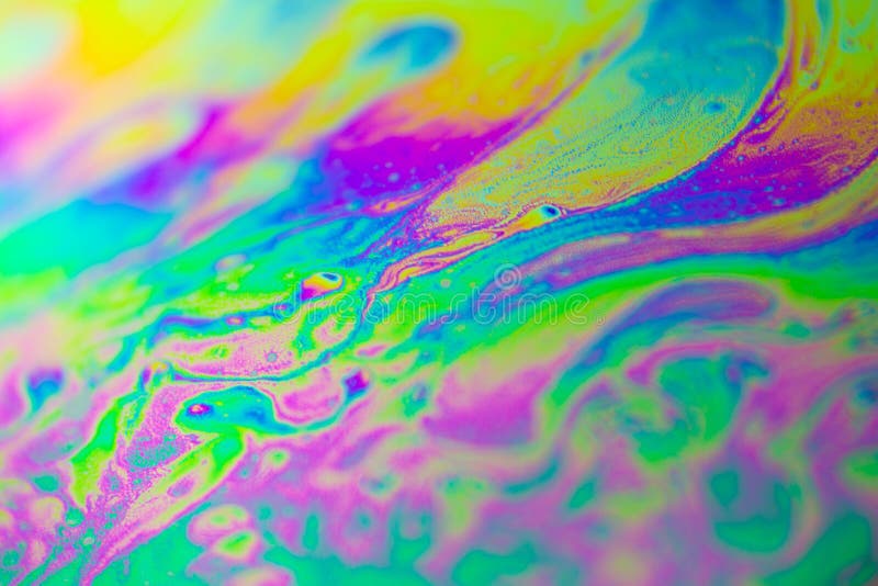 Close up macro colorful abstract soap bubble on black background.
