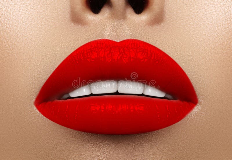Close-up macro shot of female mouth. Glamour red lips Makeup with sensuality gesture. Bloody lipstick royalty free stock photo Close-up macro shot of female mouth. Glamour red lips Makeup with sensuality gesture. Bloody lipstick royalty free stock photo