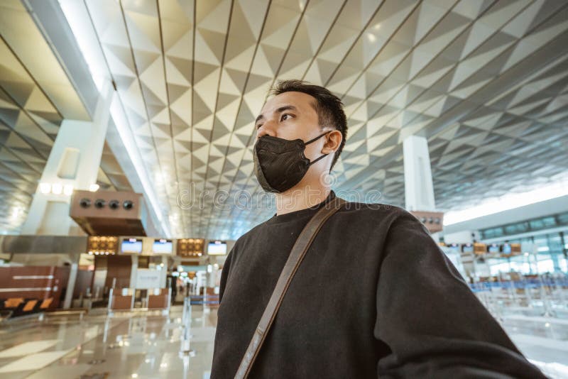 Man with Face Mask Walking in Airport Terminal Stock Image Image of