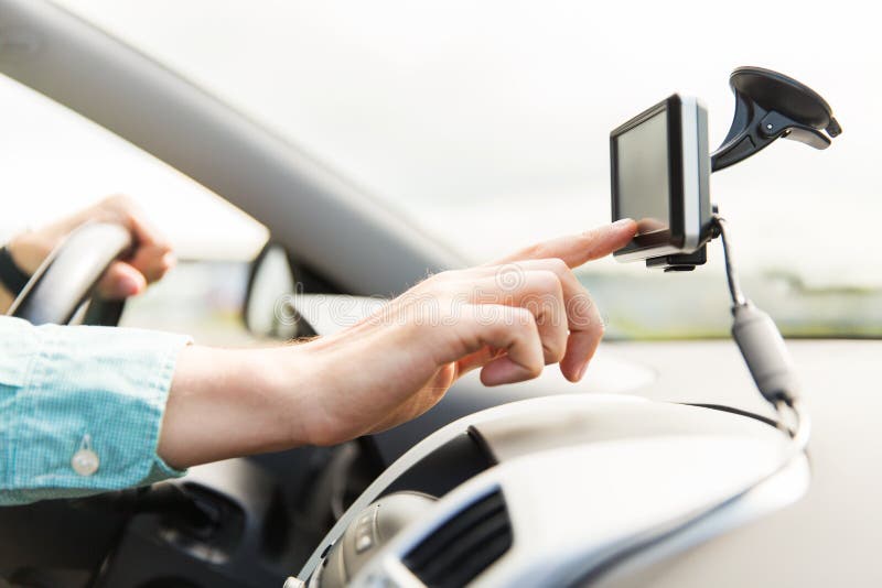 Close up of man with gps navigator driving car stock images Close up of man with gps navigator driving car stock images