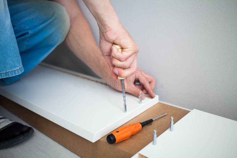 https://thumbs.dreamstime.com/b/close-up-man-hand-furniture-assembler-make-flat-pack-white-furniture-assembly-service-close-up-man-hand-furniture-assembler-210663653.jpg