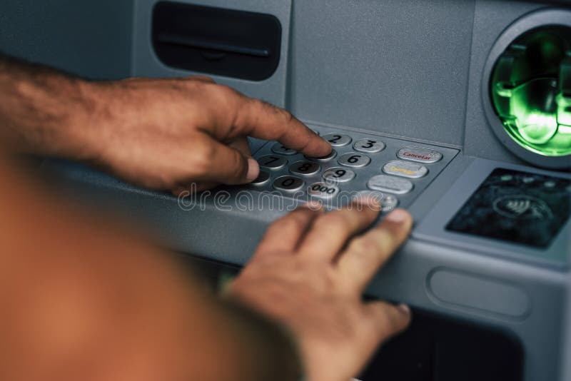 Close Up of Man Hands Typing the Secret Security Pin Code for Atm Bank