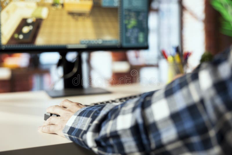 Close up of man in home office using CAD software, arranging furniture royalty free stock image