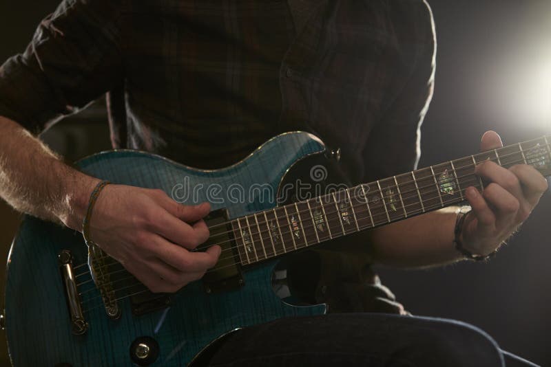 Close Up of Man Playing Electric Guitar in Studio Stock Image Image