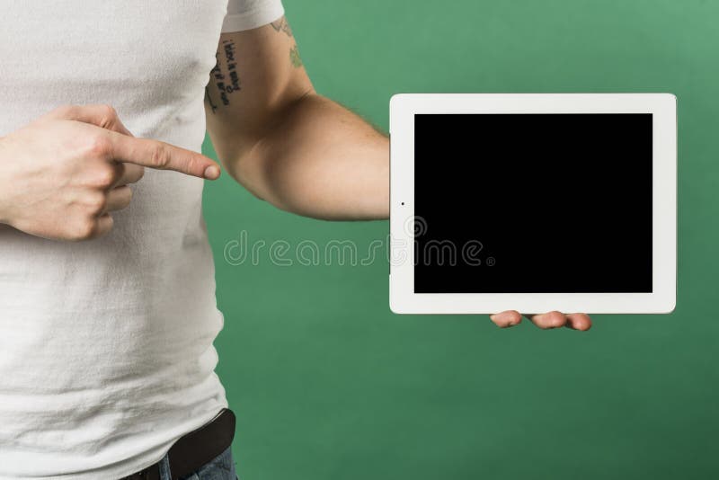 Close up man s finger pointing finger toward digital tablet with black screen display. High quality photo royalty free stock images