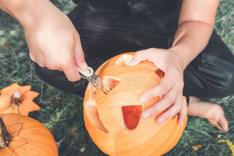 Close Up Of Man S Hand Who Cuts With Knife Pumpkin Stock Image Image