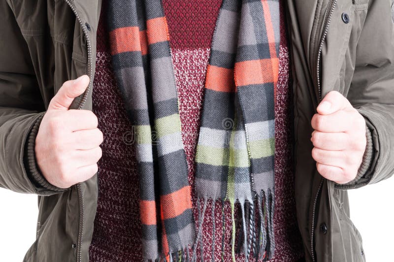 Close-up of man showing comforter sweater and jacket