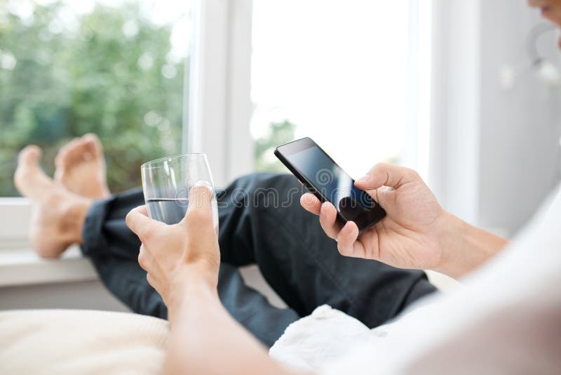 Close up of a man using mobile smart phone