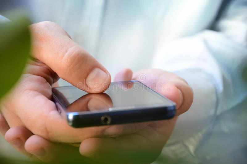 Close up a man using smart phone outdoor stock image Close up a man using smart phone outdoor stock image