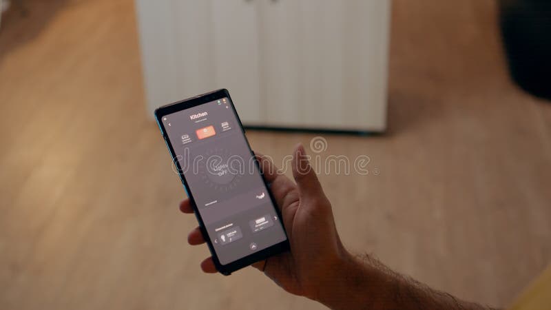 Close up of man using voice activated application to turn on bulbs royalty free stock photography
