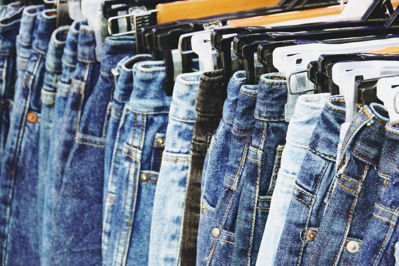 Group Of Blue Denim Jeans Hanging On A Rack Stock Photo Image of