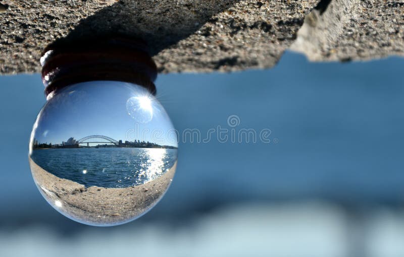 Close-Up Of Marble With Sydney Opera House and Harbour Bridge Reflection