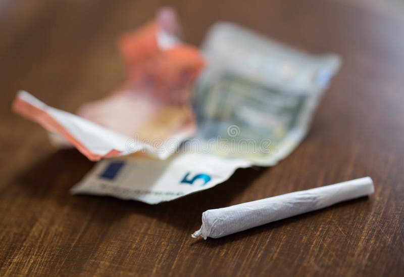 Close up of marijuana joint and money royalty free stock images Close up of marijuana joint and money royalty free stock images