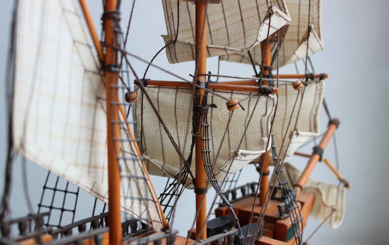 View along the deck of a wooden model of a medieval sailing ship to the bowsprit in defocus stock photography