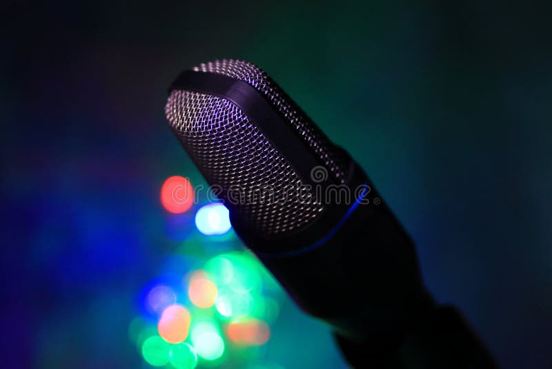 Close up of microphone for live with colorful bokeh royalty free stock photo