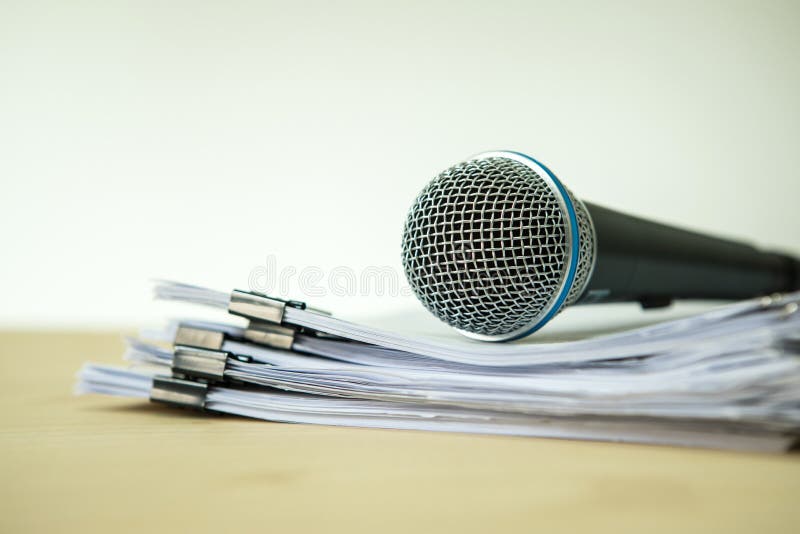 Close up a Microphone with paper document , concept of speaker o royalty free stock photography