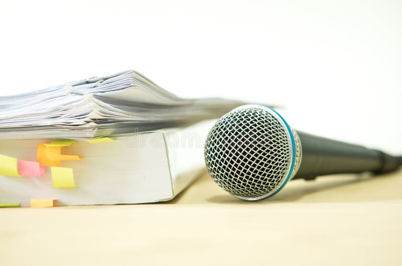 Close up a Microphone with paper document , concept of speaker o stock photo