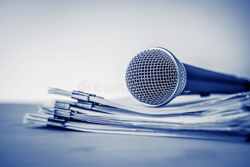 Close up a Microphone with paper document , concept of speaker o royalty free stock photos
