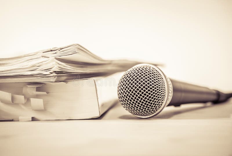 Close up a Microphone with paper document , concept of speaker o stock photography