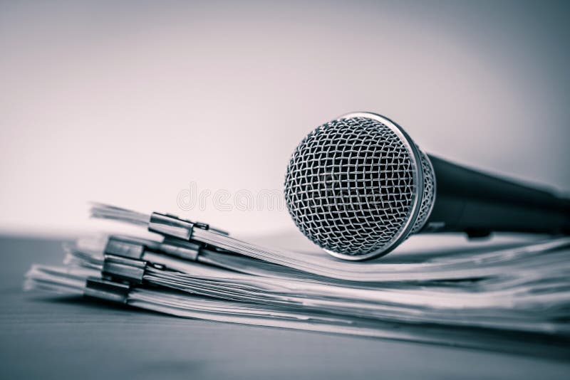 Close up a Microphone with paper document , concept of speaker o royalty free stock photo
