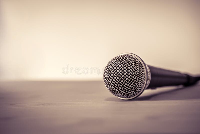 Close up a Microphone on the table, concept of speaker or teacher preparation to speak in seminar class room royalty free stock photography