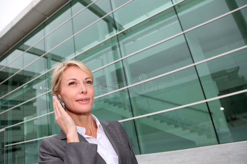 Close-up of middle-aged woman on the phone royalty free stock image