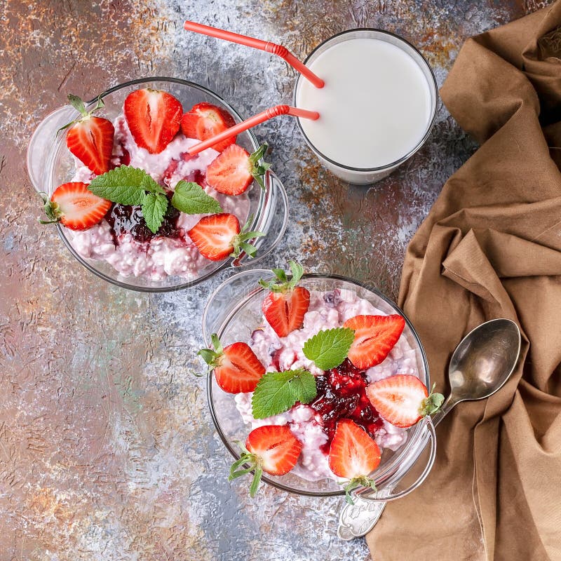 Close Up. Milk, cottage cheese, jam, yogurt with fresh strawberries and mint leaves. Top view royalty free stock images Close Up. Milk, cottage cheese, jam, yogurt with fresh strawberries and mint leaves. Top view royalty free stock images