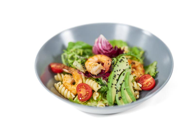 Plate with appetizing pasta in vegetables and with seafood. stock photo