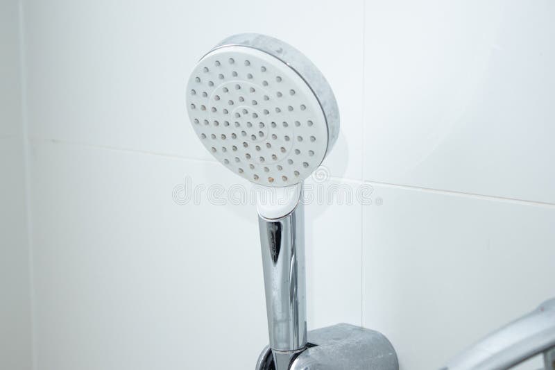 Close up of a modern shower head with limescale stains royalty free stock image