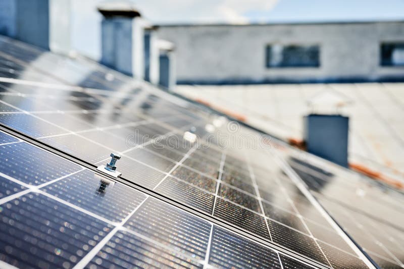 Close up of mounting hardware on solar panel, focusing on the details of the securing mechanism.