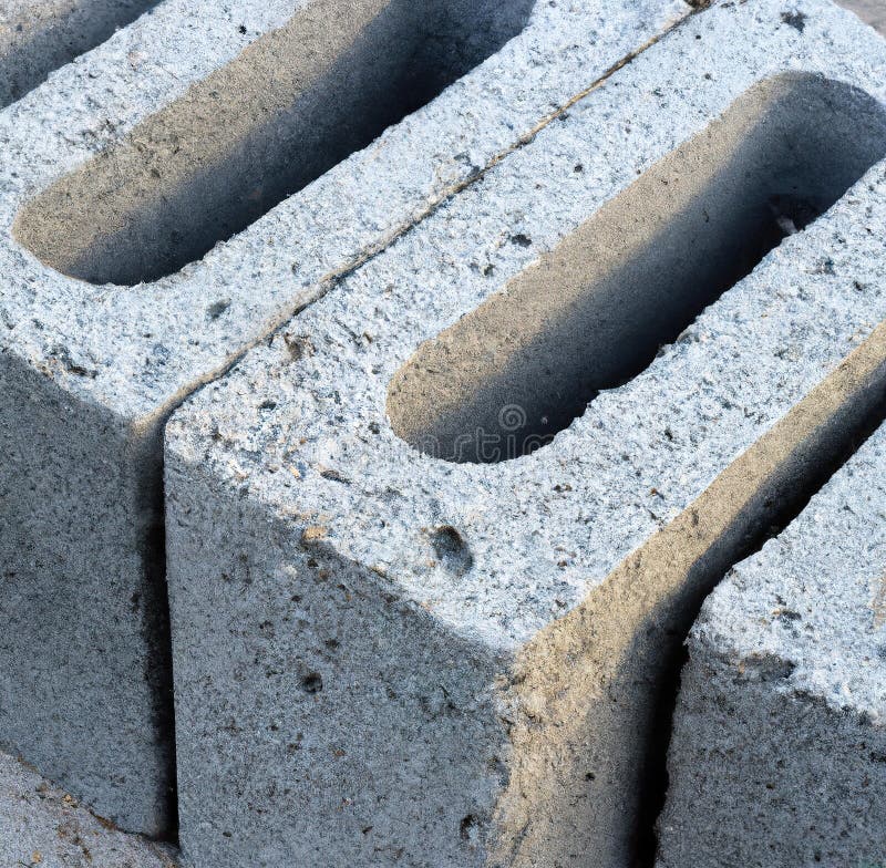 Close Up of Multiple Grey Cinder Blocks on Street Stock Photo Image