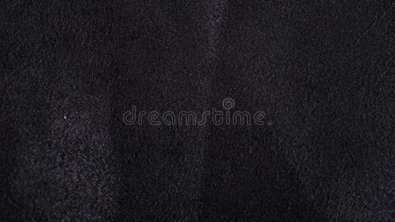 Close up of natural black suede leather background royalty free stock image