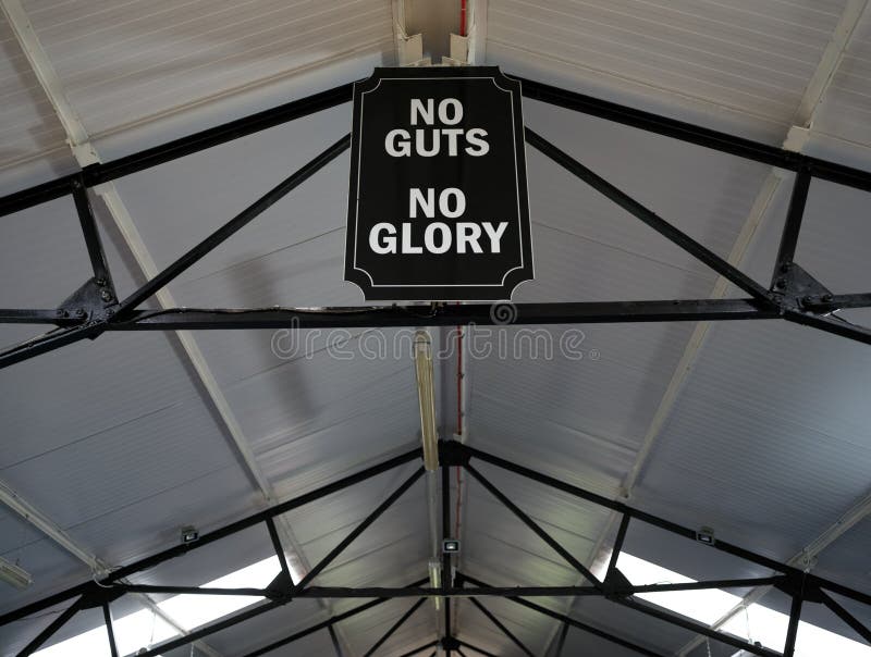 Close Up Of No Guts No Glory Sign In Boxing Training Gym