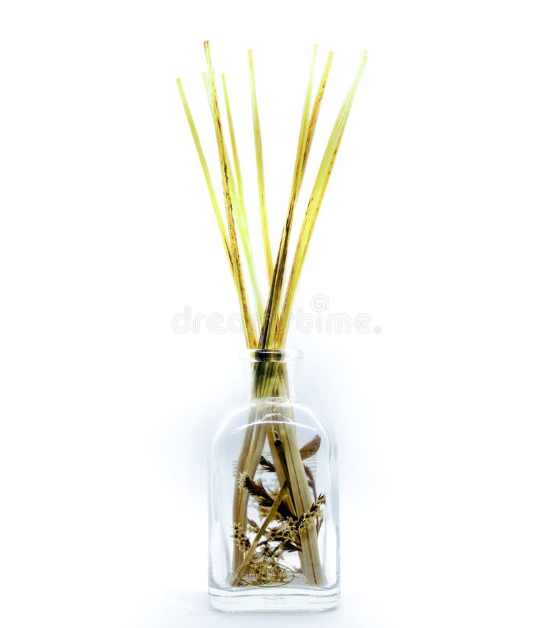 Close up of an object with wood sticks in liquid for home fragrance or no fire aroma diffuser with sticks