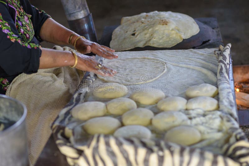 Muslim woman making food.