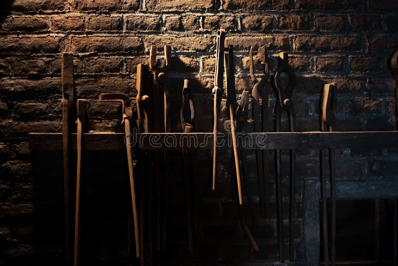 Close up of old vintage tools from a blacksmith display royalty free stock images