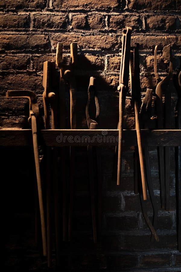Close up of old vintage tools from a blacksmith display royalty free stock photos