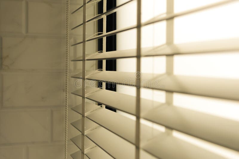 Close-up open venetian blinds. lighting range control sunlight coming from a window. decoration interior. Modern jalousie