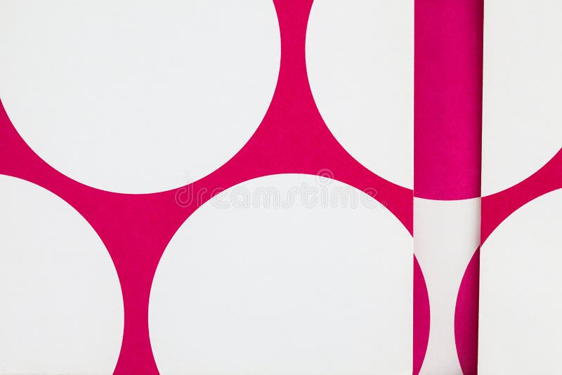 A close up of paper with cut printed circles.