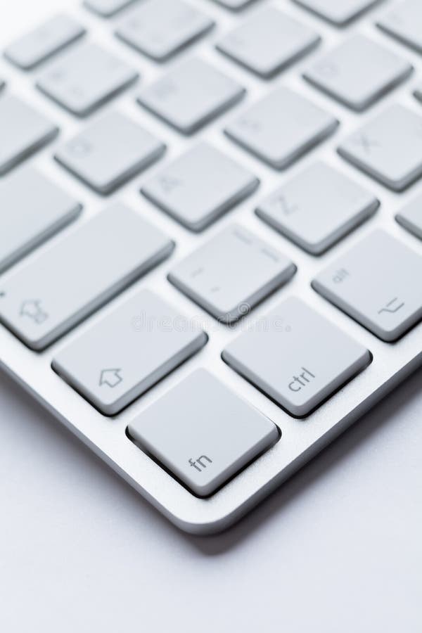 Close up of part angle of light keyboard of the computer, isolated on white