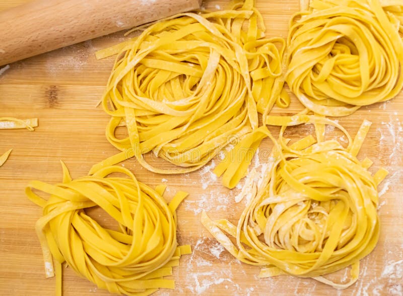 Close Up of Pasta and Hands Making Home Made Italian Pasta Stock Image