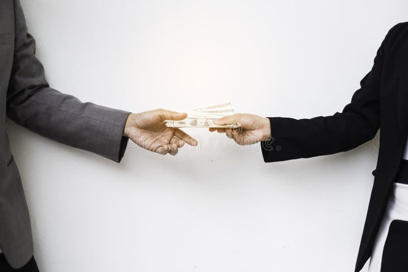 Close-up Of Person Hand Giving Money To Other Hand