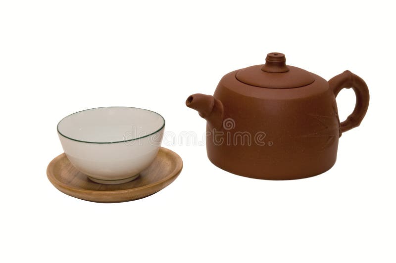 Close-up photo of brown teapot with teacup