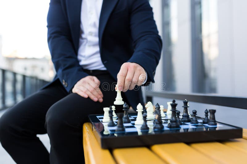 Close-up Photo of Businessman`s Hands Making a Move on a Chessboard ...