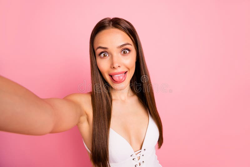 Close up photo of carefree childish person make photo faces dressed swim wear isolated over pink background