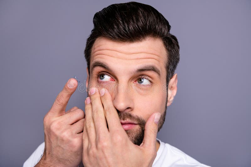 Close up photo charming youth have eye sight problem need correction hyperopia look want good eye condition stubble stock photography